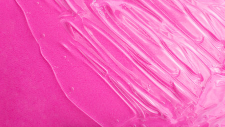 Top view of liquid cosmetics gel structure on pink background.Good as cosmetic mockup,copy space.の写真素材