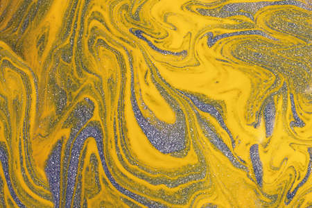 Shimmer yellow and blue background,make from liquid nail polishes.Good as cosmetics backdrop.の写真素材