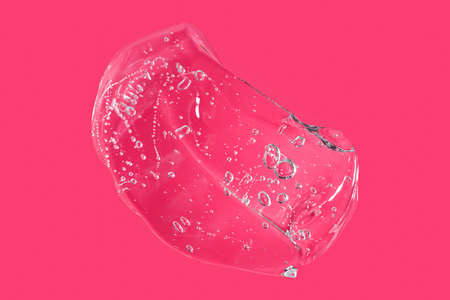 Top view of liquid cosmetics gel with bubbly structure on pink background.Good as cosmetic mockup.の写真素材