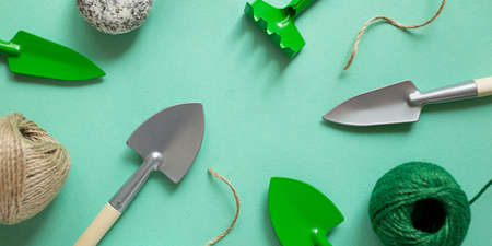 Frame from gardening tools and rope.House plant care concept.Photography from above,large banner.の写真素材