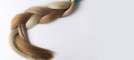 Braided hair sections for extension on white background,banner with copy space.の写真素材