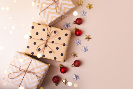 Top view of several gift box wrapped in craft paper with festive decoration.の写真素材