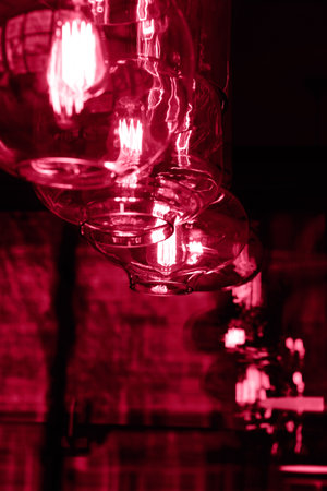 Edison lamps in red color.Vertical background,good for text overlay.の写真素材