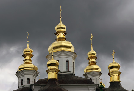 Golden domes of orthodox church against grey skyのeditorial素材