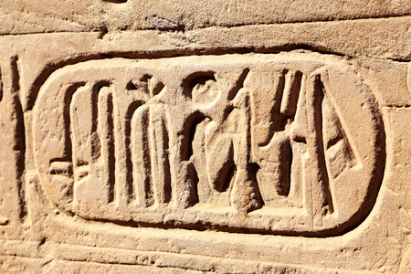 Egyptian symbols on the wall of ancient temple, kartushのeditorial素材