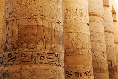 Egyptian symbols on the pillars of ancient temple in Luxor