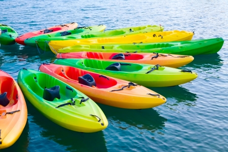  Group of colorful kayaks on waterの写真素材
