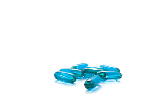 Medicine concept. Pill isolated on white background. A bunch of blue pills isolated on white.の写真素材