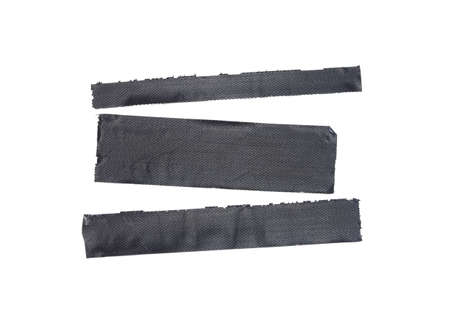 Duct tape or duck tape torn strips of isolated elements of strong adhesive material used in packaging boxes or repairing or fixing broken.の写真素材