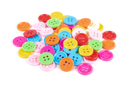 colorful plastic sewing buttons isolated on white