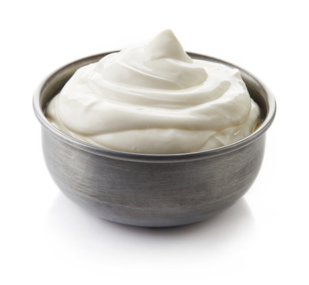 Bowl of cream on white backgroundの写真素材