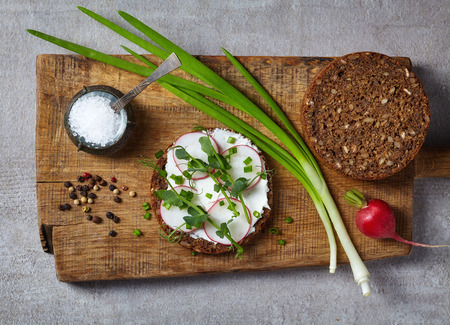 Healthy sandwiches with multi grain bread, cream cheese and greens, top viewの写真素材