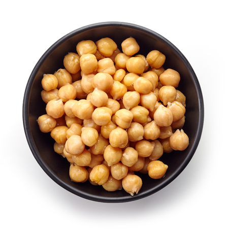 Black bowl of preserved chickpeas isolated on white background, top viewの写真素材