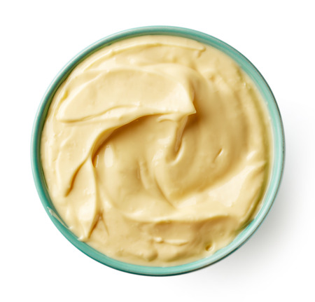 Mayonnaise in blue bowl isolated on white background, from aboveの写真素材