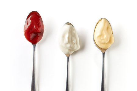 Sour cream, ketchup and mayonnaise in spoon, isolated on white background, top viewの写真素材