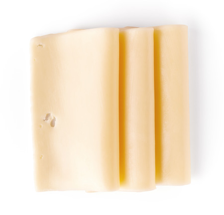 Sliced cheese isolated on white background, top viewの写真素材