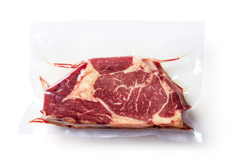 Beaf steak vacuum sealed ready for sous vide cooking isolated on white background, top viewの写真素材