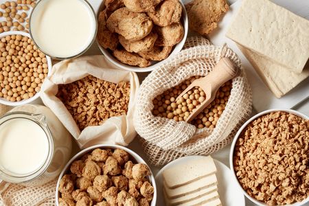 Soy products: soy beans, soy milk, tofu and soya chunks isolated on white background, top viewの写真素材