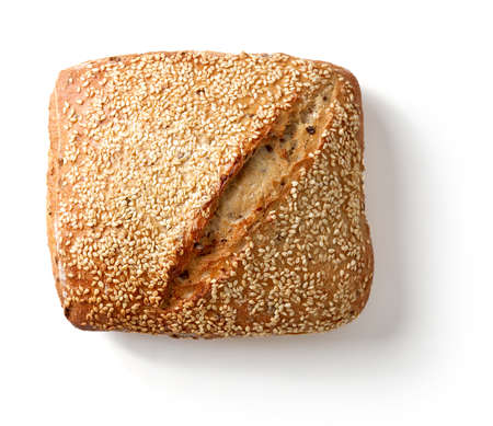 Freshly baked loaf of bread isolated on white background, top view