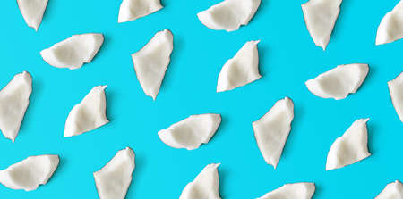 Colorful coconut pieces pattern, top view