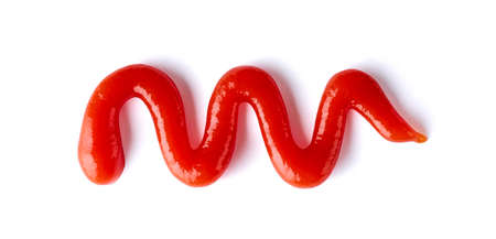 Splashes of tomato ketchup isolated on white background, top viewの写真素材