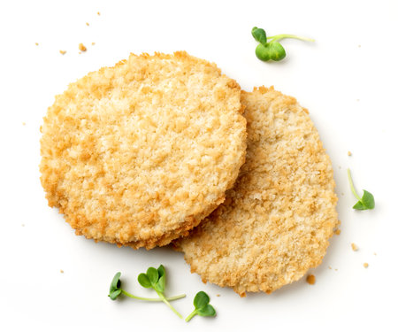 Plant based burger patty with grill marks isolated on white backgroundの写真素材