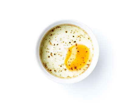 Baked egg isolated on white background, top viewの写真素材