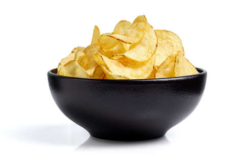 Black bowl of plain salted potato chips isolated on white background