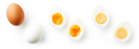 Halved hard and soft boiled eggs isolated on white background, top viewの写真素材