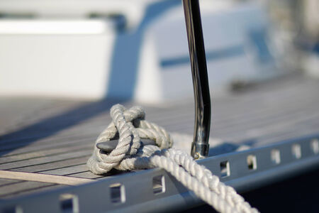 Tied knot on the desk of a sailing boat 