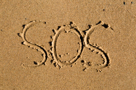 Casual writing in the wet sand on a sunny day.の写真素材
