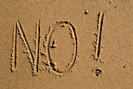 Casual writing in the wet sand on a sunny day.