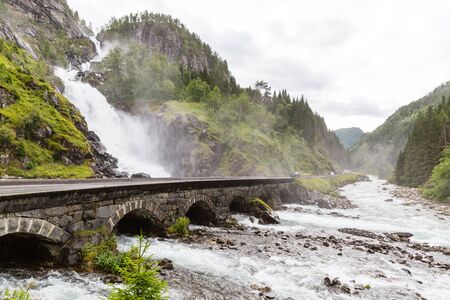 The popular LÃ¥tefossen waterfalls near the Norwegian town of Odda in western Norway.の写真素材