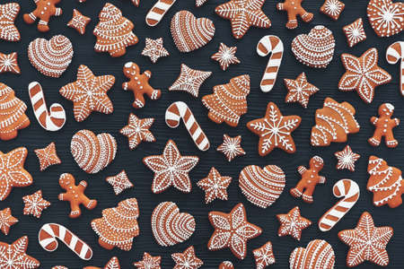 Set of gingerbread on dark wooden background. Christmas cookies.の写真素材