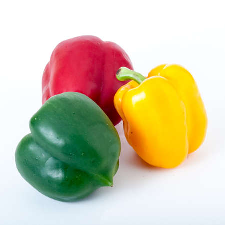 set of colored bell peppers,Red and yellow and green sweet pepper isolated on white background,Colored paprika (pepper) isolated on a white backgroundの写真素材