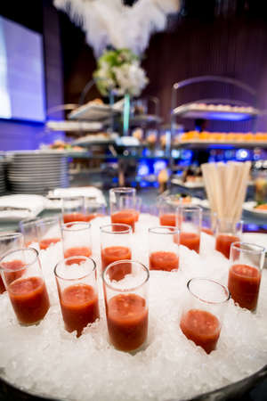 canapes on toothpicks , appetizer, pinchos , spanish food ,delicious finger food,tomato juice glass isolated on iceのeditorial素材