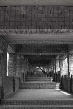 stairway in the village,Long Flight of Old Stone Steps Leading up a Dark Alleyway,Old vintage stone stair way.の写真素材