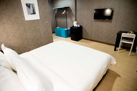 Modern tastefully and simply decorated bedroom of a small hotelのeditorial素材