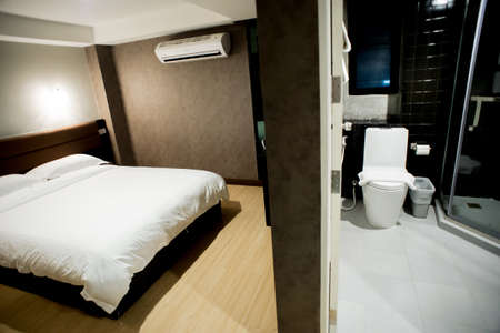 Modern tastefully and simply decorated bedroom of a small hotelのeditorial素材