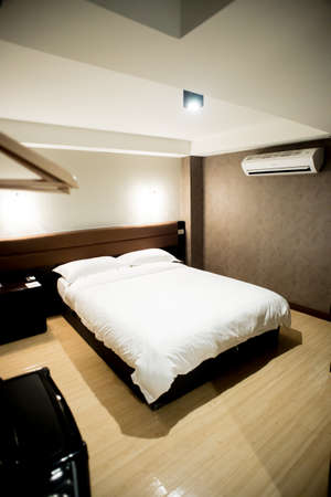 Modern tastefully and simply decorated bedroom of a small hotelのeditorial素材