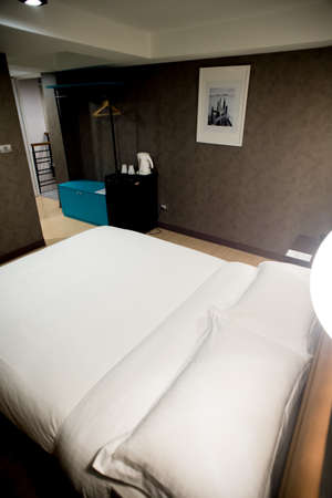 Modern tastefully and simply decorated bedroom of a small hotelのeditorial素材