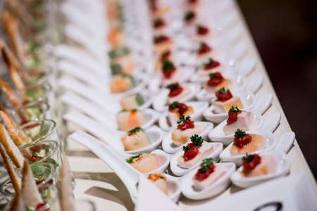 canapes on toothpicks , appetizer, pinchos , spanish food ,delicious finger food,の写真素材