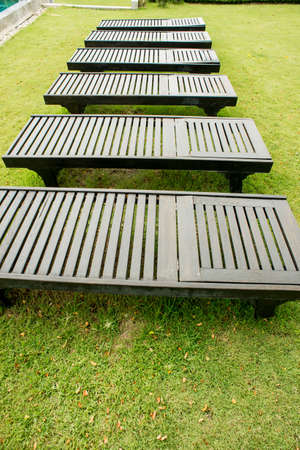 wooden sunbeds and swimming pool,Beds by the poolの写真素材