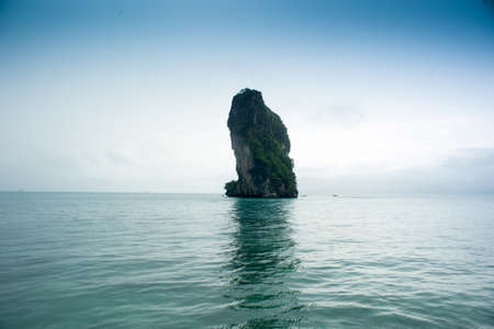 Small island on beautiful sea with sparkling waters in Krabi, Thailand.の写真素材