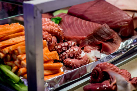 some salmon sashimi in a glass box wait for eat