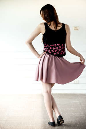 Young woman wearing blank sleeveless t-shirt,Young woman wearing blank vest. wall background.Casual...