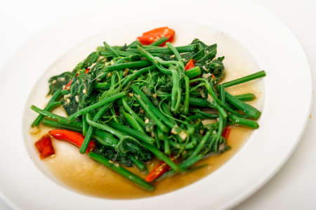 Fried bitter gourd leaf with oyster sauce , Thai style food,Stir-Fried Sayate Wish Salted Soya Bean,...