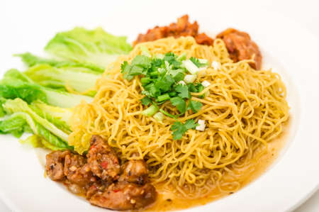 Chinese roast pork noodle ready to eat with chopstick,Chinese instant noodle with minced pork bowl isolated on white backgroundの写真素材