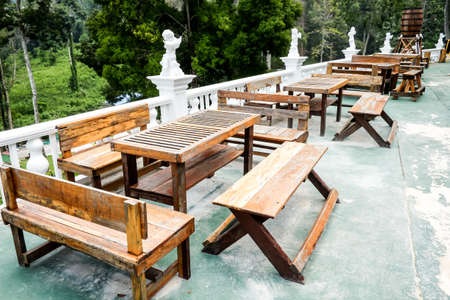 Wooden table set in the garden.の写真素材
