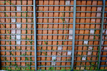 Baked Clay Roof tier on rusty iron barsの写真素材
